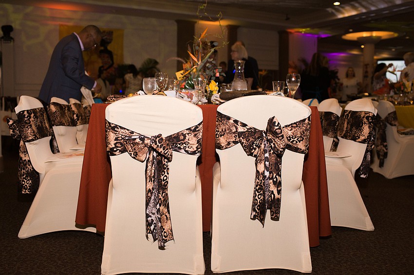 The table decor and chairs featured warm, bright colors and animal prints.