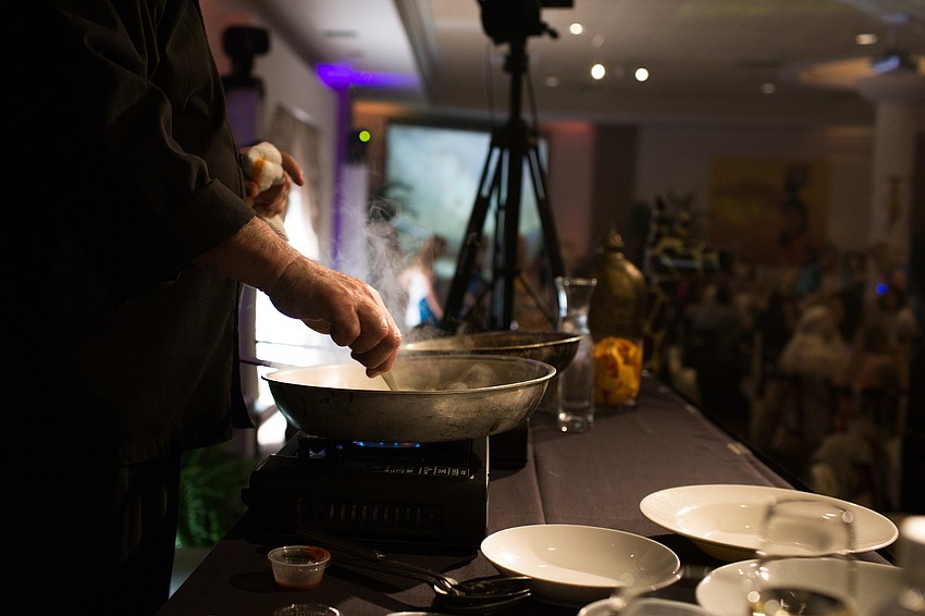 Executive Chef Jamil Pineda cooks his dish under a mirror so guests can see what he is doing.