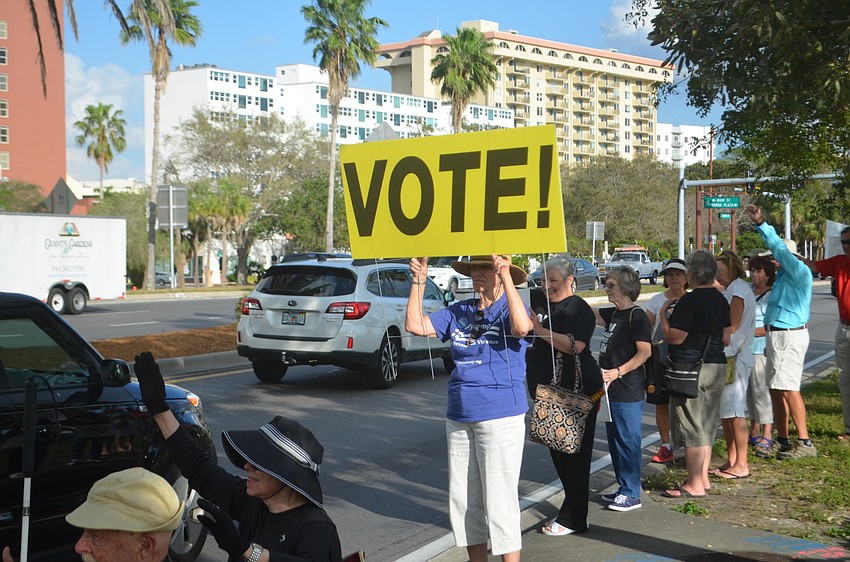 Sandy Wilbur held aloft a sign that simply said 