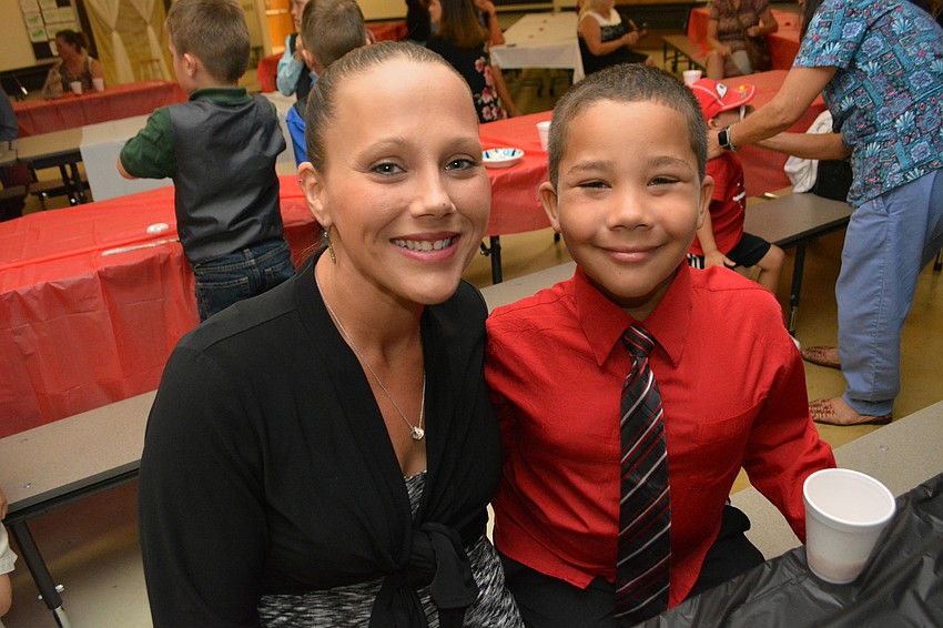 Seven-year-old Davian Cheaves, with his mom Nichole, says he is most excited about getting to eat cupcakes.