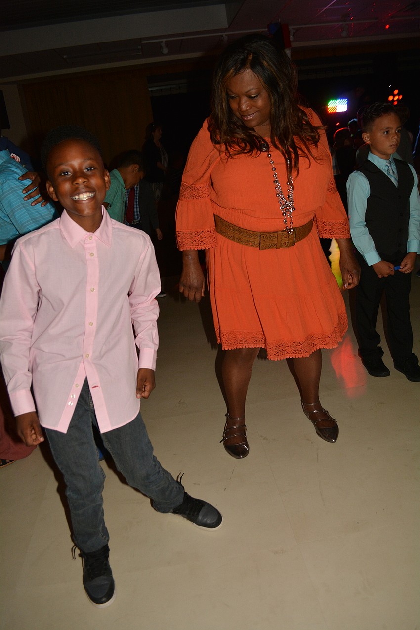 Jacob Douglas, 11, attends with his aunt Tiffany Gibson, a paraprofessional at the school.