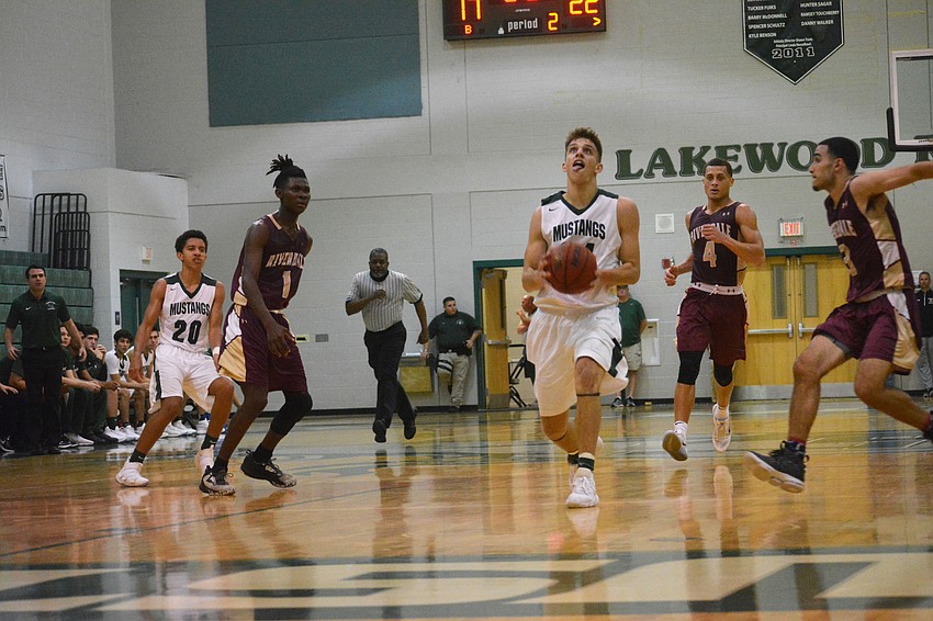 Senior Jack Kelley drives an open lane against Riverdale. Kelley finished with 24 points.