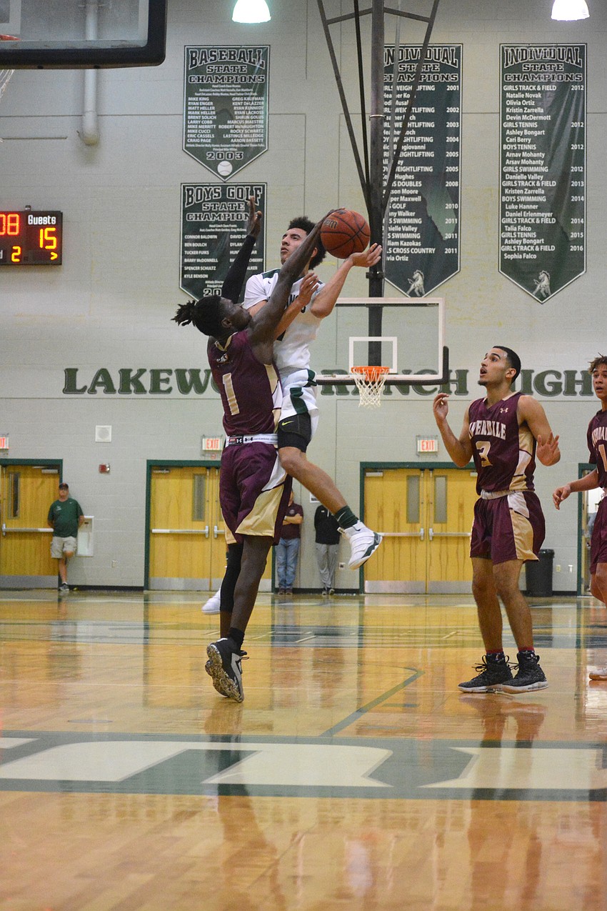 Senior Evan Spiller gets fouled by a Riverdale defender.