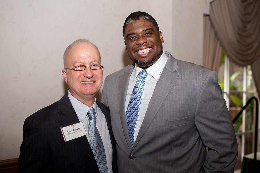 Literacy Council of Sarasota Executive Director Tom Melville and guest speaker Craig Boykin