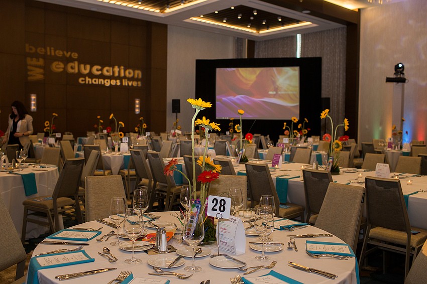 The ballroom of the Westin Sarasota was neatly decorated with small pops of color.