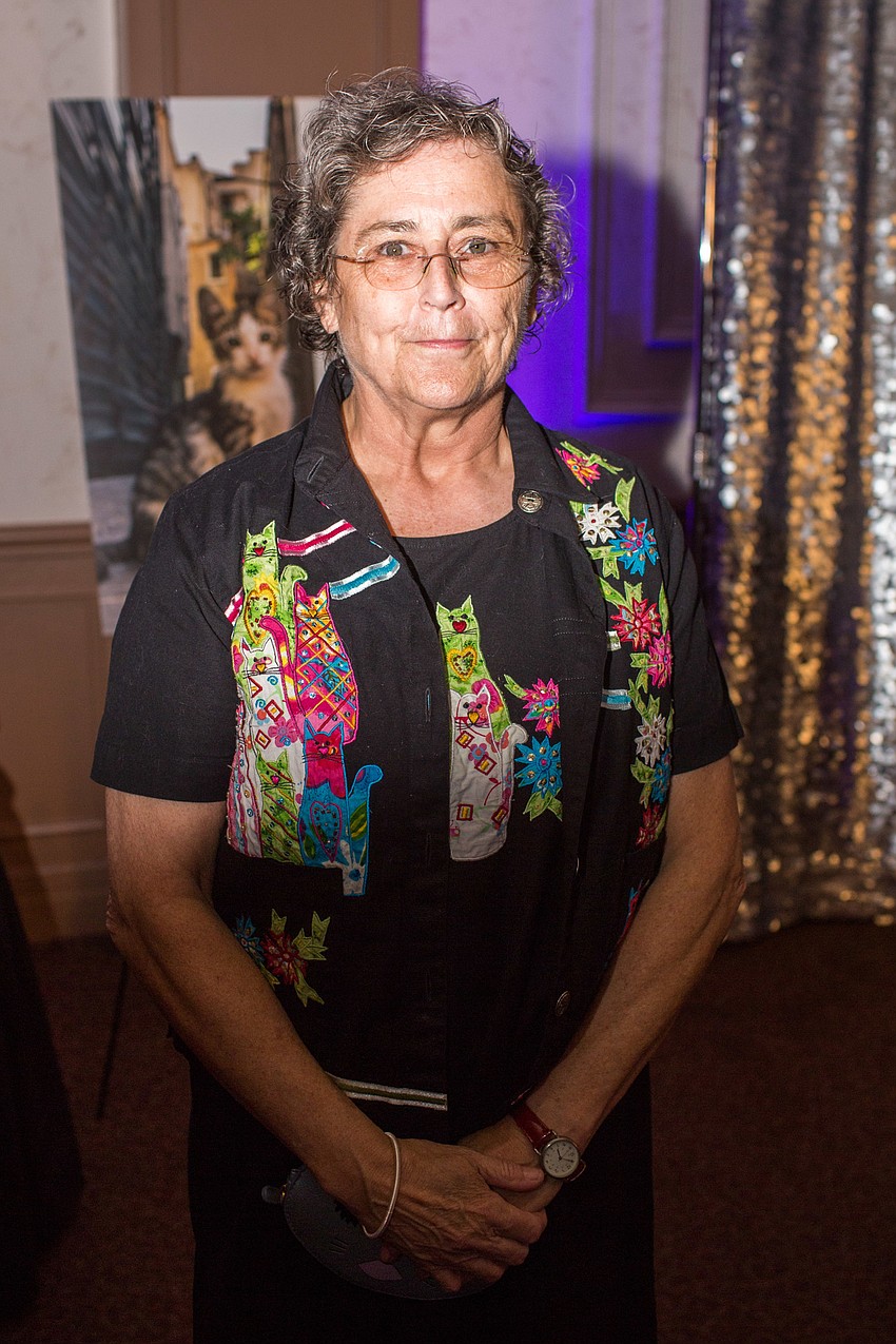 Mary Budd sports her favorite cat dress to honor her four kitties, Moonlight, Mr. Nosey, SaraJane and Pepper.