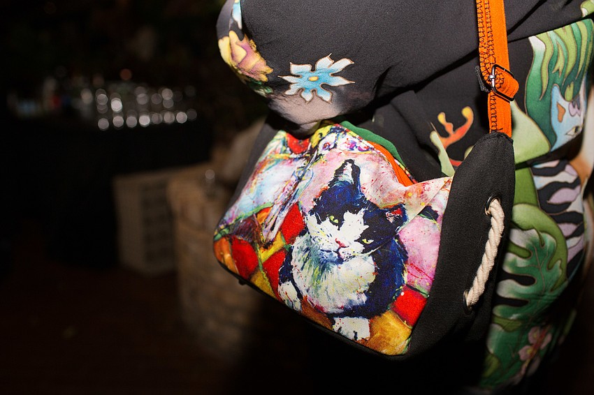 Madeline Young wears her Laurel Burch cat purse.