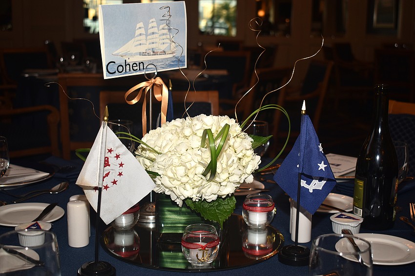 Floral centerpieces decorate each dinner table.