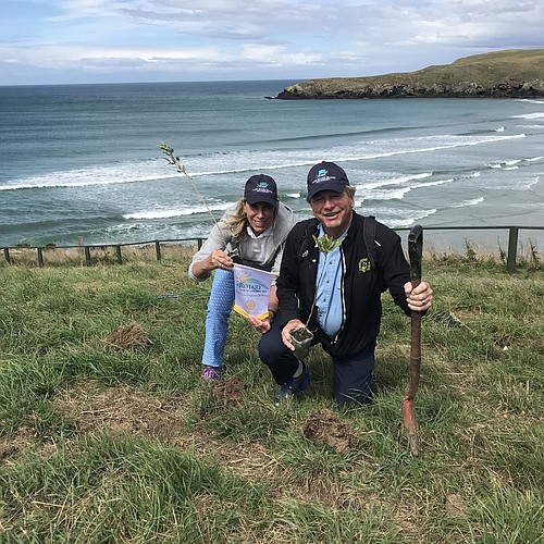 Nancy and Jack Rozance plant two trees in New Zealand.