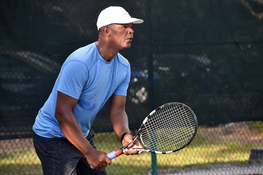 Ron Shields warms up for a competition between Longboat Key Public Tennis and the Longboat Key Club on Feb. 27, 2018.