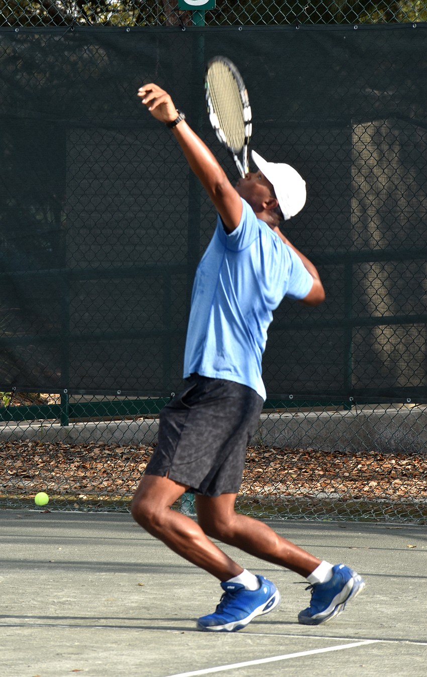 Ron Shields serves the ball.