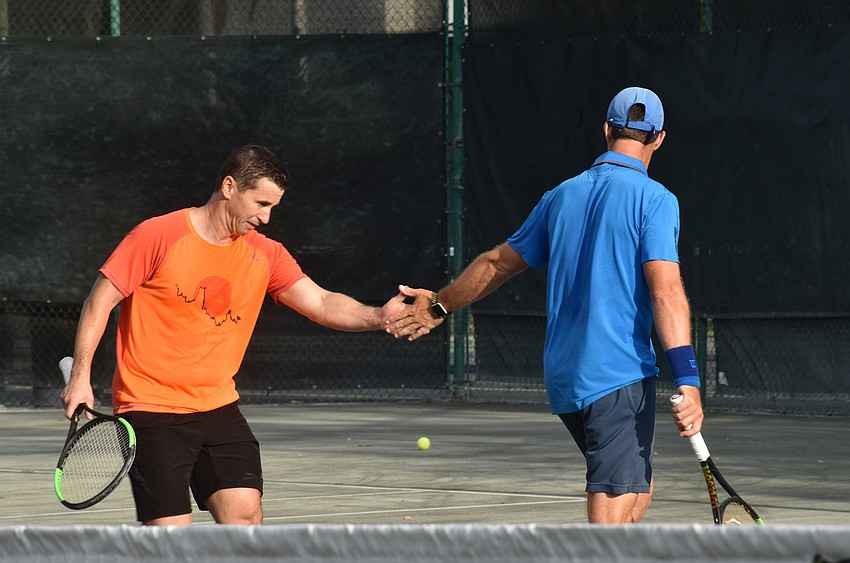 Sergiu and Claudiu Retean high five after a play.
