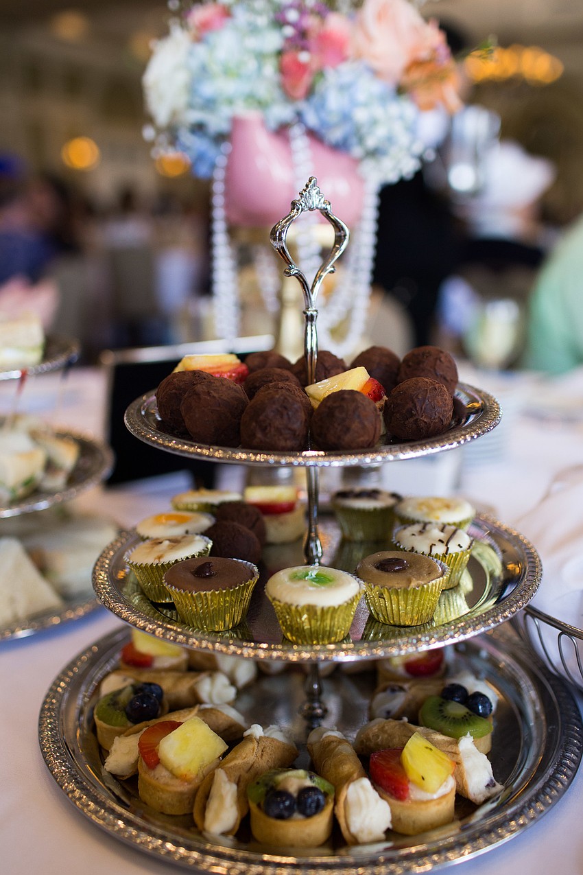Many different desserts were neatly arranged on the trays.