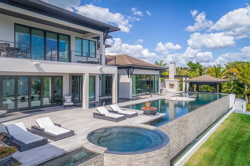 Along with multiple pools, the home also includes a koi pond.
