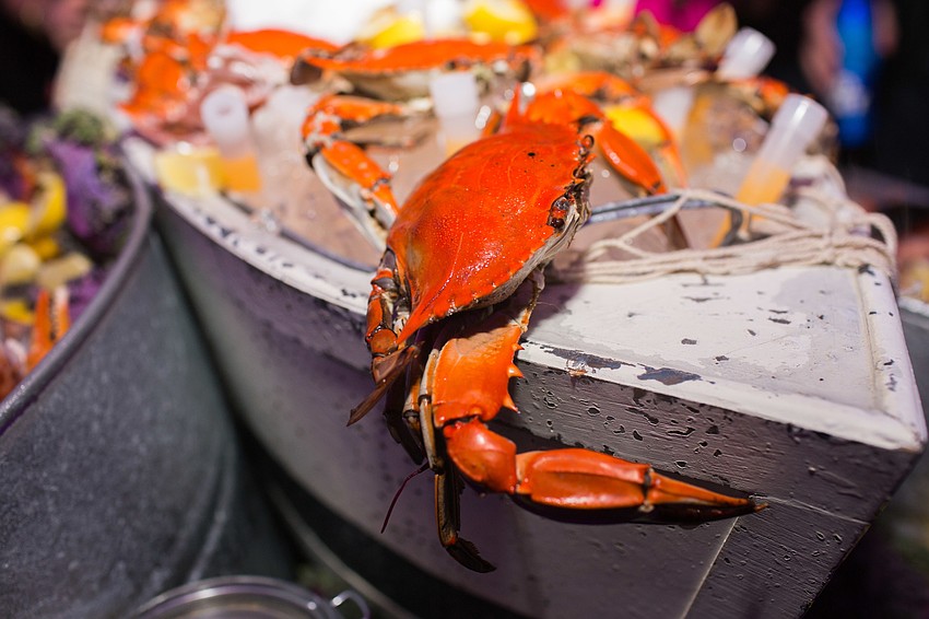 Fresh seafood was decorated around mini boats.