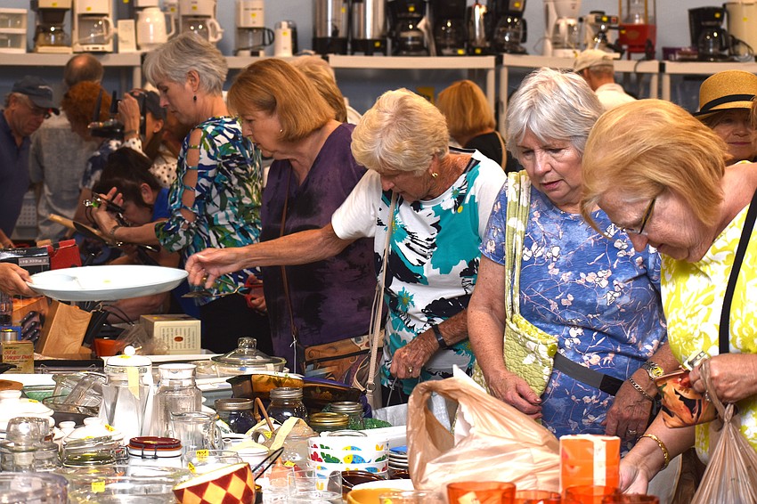 Customers peruse the kitchen items.
