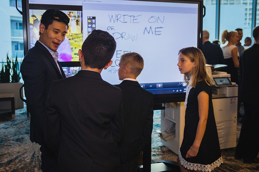 Kyle Butler of Rise talks with Jacob Todd, Benjamin Todd and Bryce Potter.