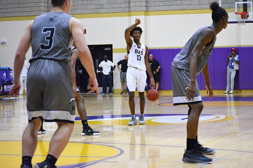 Junior guard Jordan Clark controls the point in the first quarter.