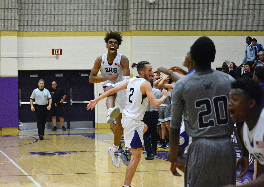 Johnnie Williams IV and Hudson Gough celebrate following Mariner's game-ending turnover.