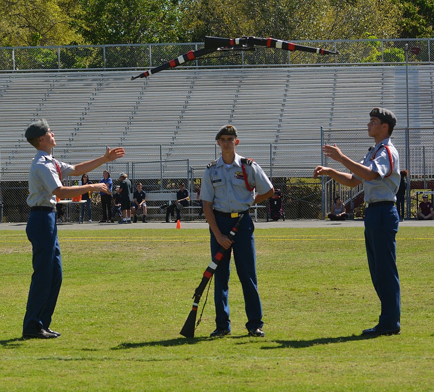 Commander center Beck Stout is calm while Kyle Krage, left, and Mateo Lewis, right, trade rifles during Squad Exhibition action.