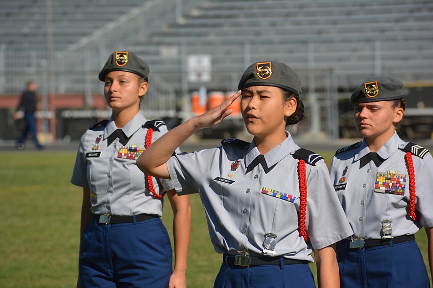 Adi McCane, Ayaka Queson and Gina Pressimone ask the judges for permission to begin a drill.