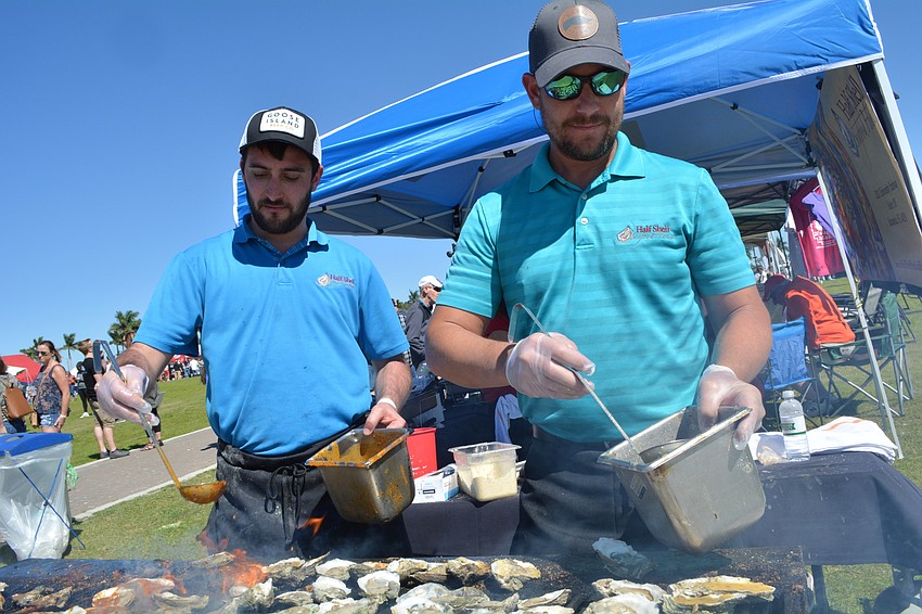 Sean Ferguson and Jerry Stennett grill up oysters for Half Shell Seafood House.