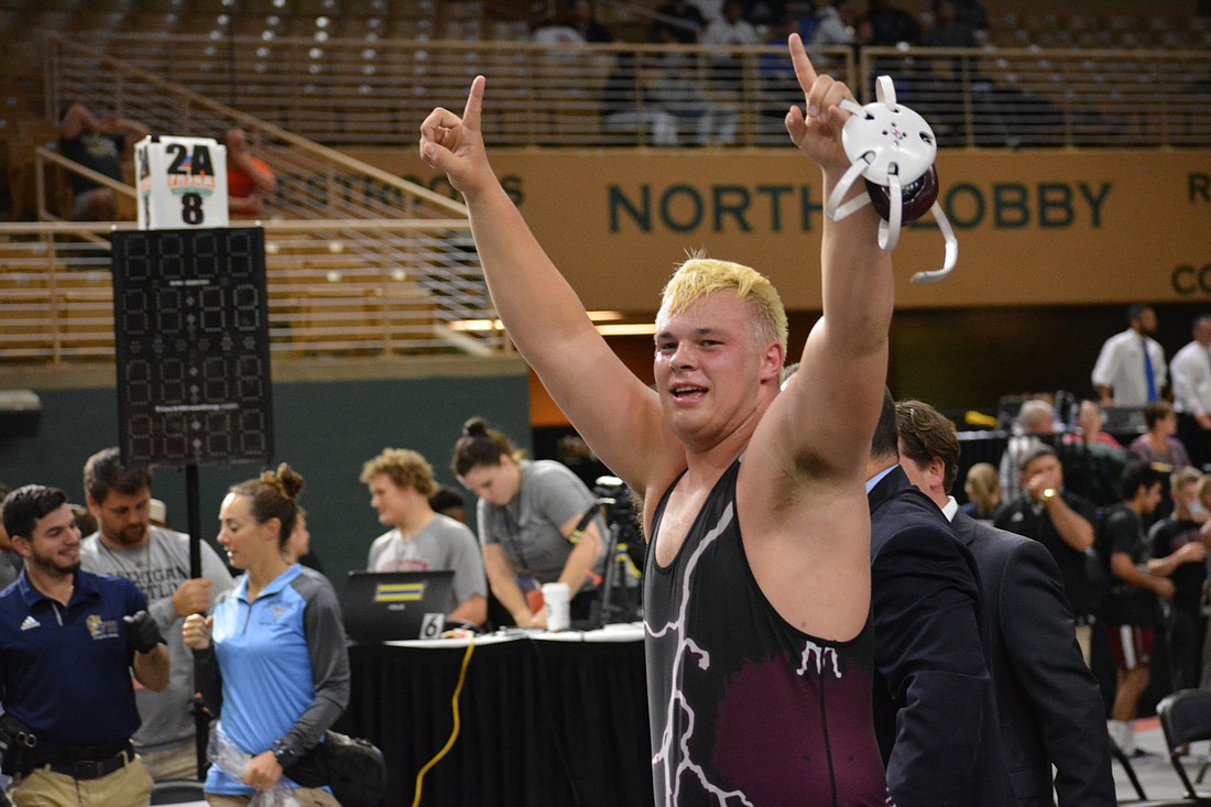 Brendan Bengtsson is all smiles after winning the  the Class 2A heavyweight state title.