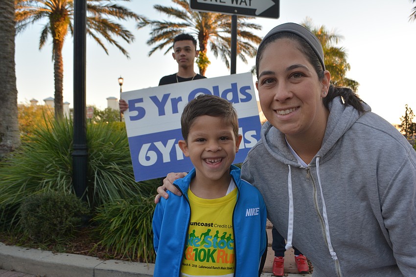 Lakewood Ranch's Liam Pacheco, 6, gets support from mom, Aileen Pacheco, before beginning his race.
