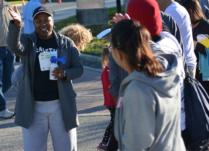Diana Greene, the School District of Manatee County superintendent, offers encouragement at the start of the race.