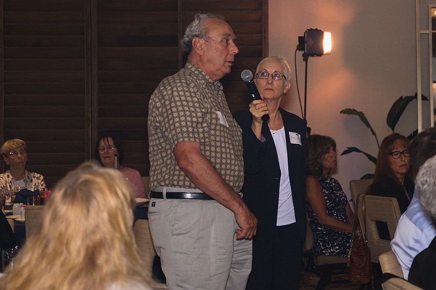 Gerald Legace asks the event's speaker, Joyce Arditti, a question.