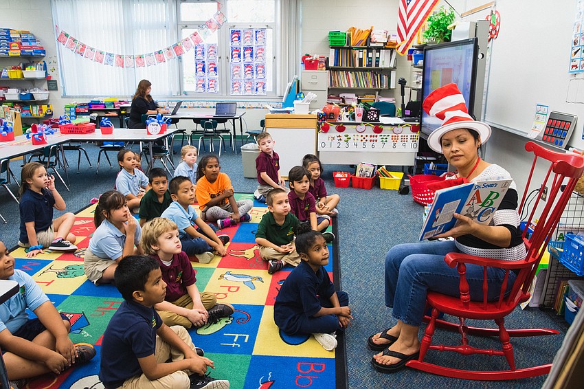 Tuttle Elementary kindergarten teacher Martha Ibarra reads 