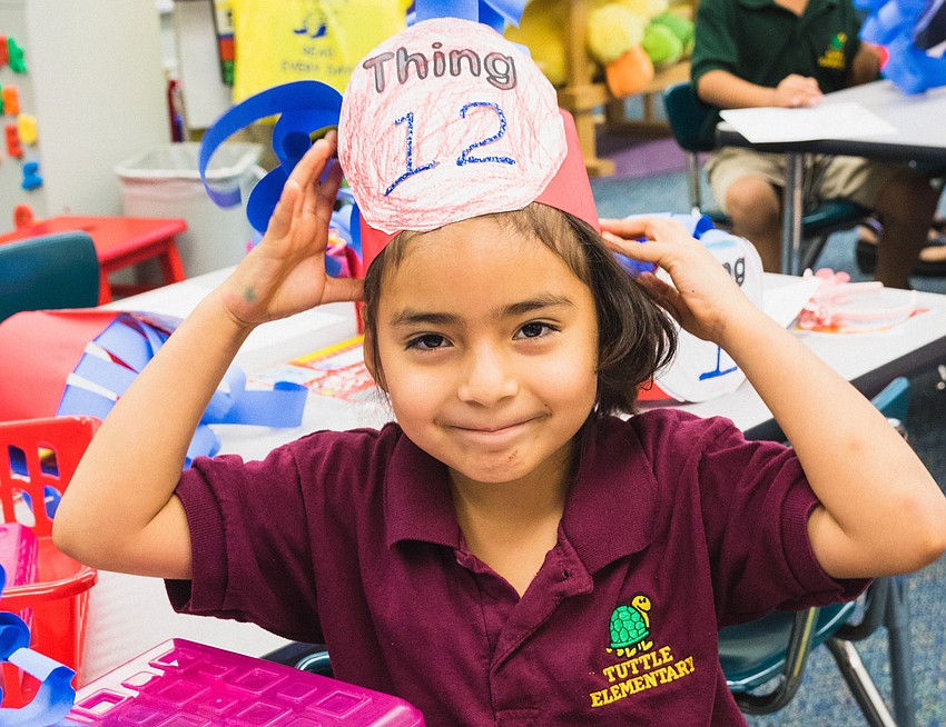 Yaritza Martinez shows off her Thing 12 hat.