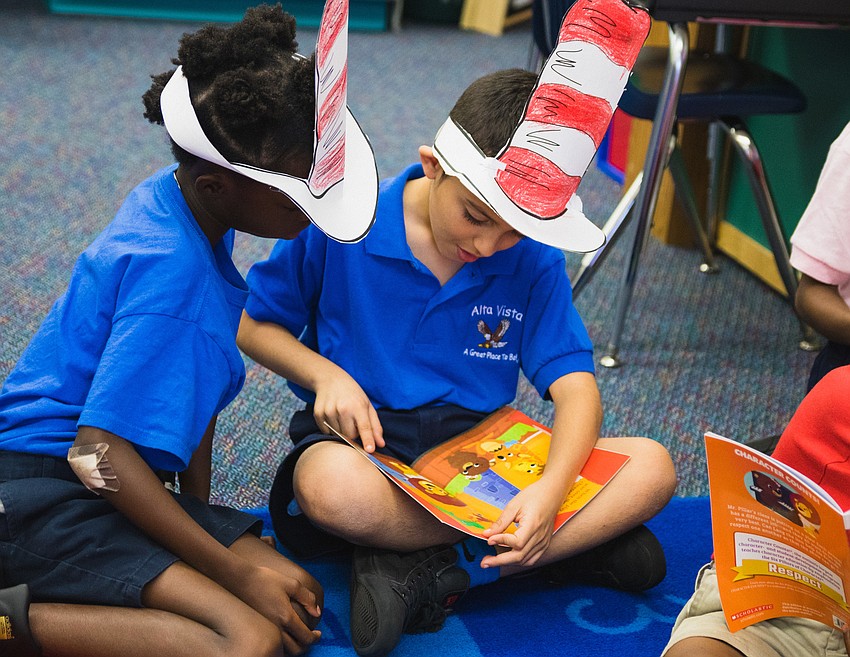 Ja'Niyah Fowler and Ezequis Parada read together.