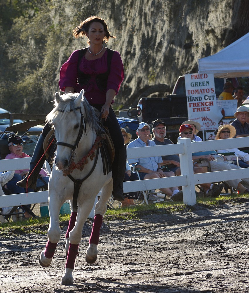 Rachael Hughes shows off one of the Lipizzan stallions.