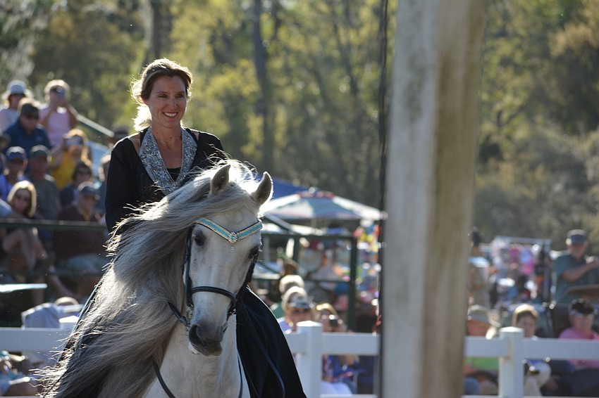 Rebecca McCullough and her Lipizzan stallion thrill the crowd.