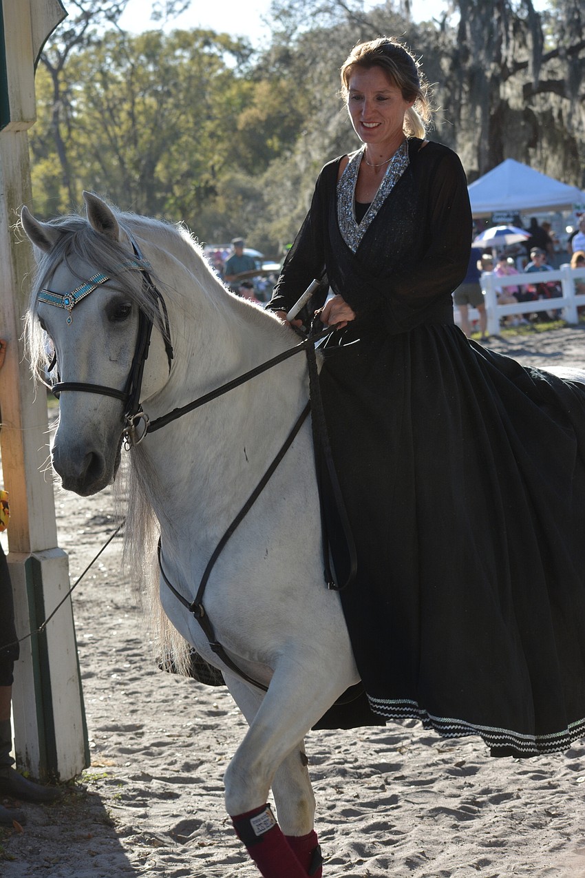 Rebecca McCullough heads back to the barn after a performance.