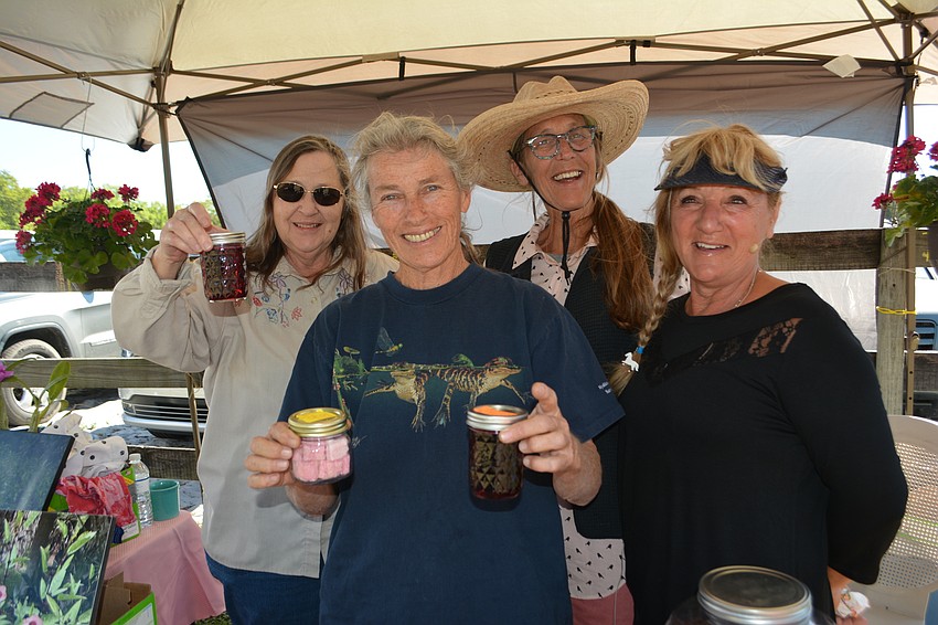Leah Stone, Mary Stone, Beth Steele and Gabby Herrmann show off the Wild Sorrrel Sisters jelly available at the benefit.