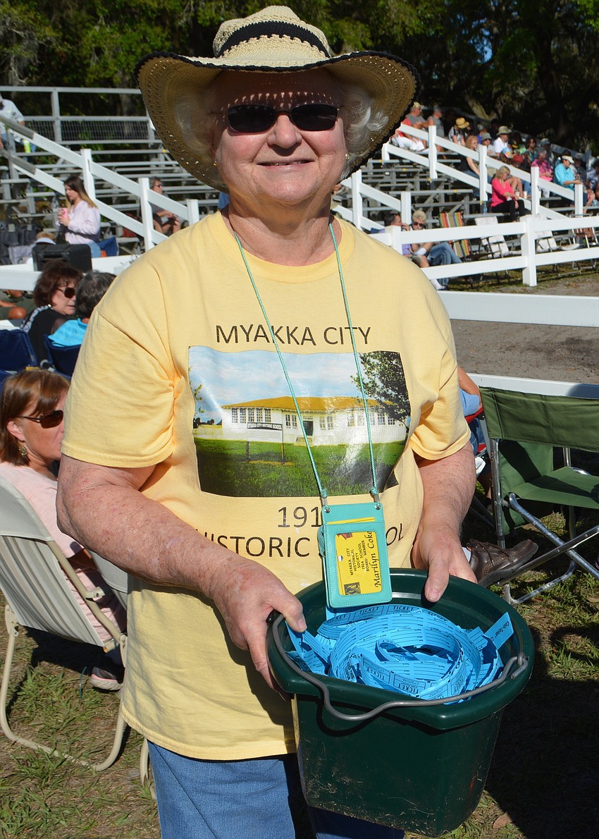 Marilyn Coker, the president of the Myakka City Historical Society, sells 50-50 tickets to raise money for the renovation of the Historic School House.