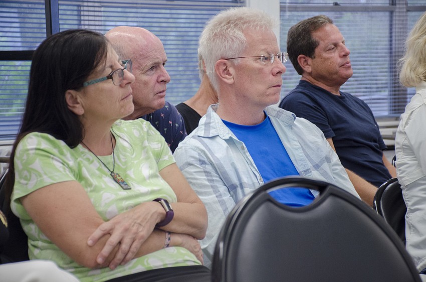 Eric Warneke (right) said the forum created a convenient space for him to hear what each of the candidates think outside of what he's read in the newspaper.