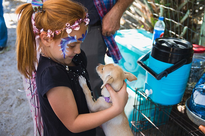 Natalie Reaves holds a puppy.