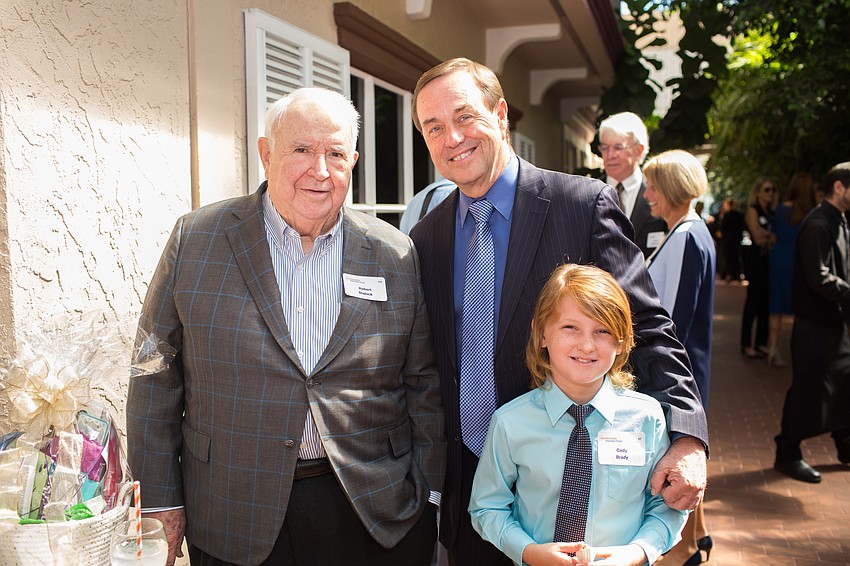 Bob Blalock, Executive Director Tom Waters and Cody Brady