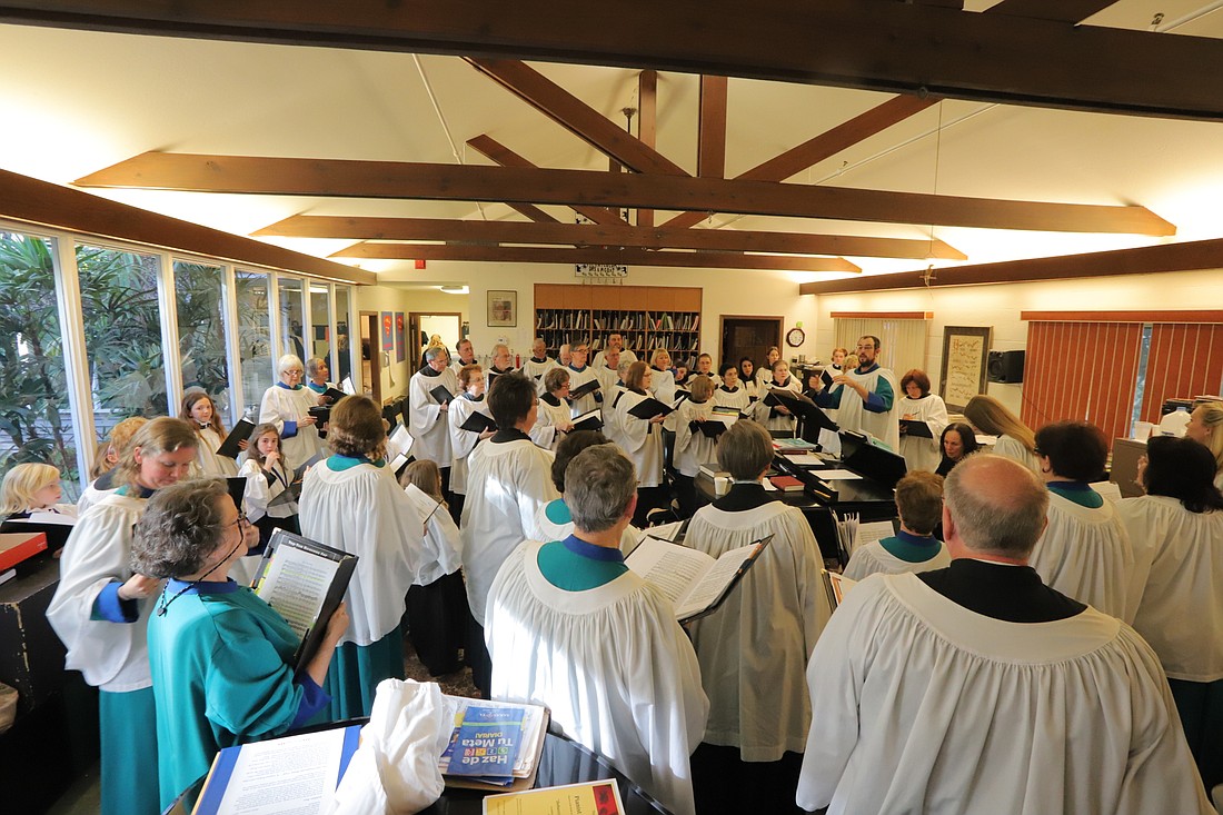 Choir members from the two churches rehearse for the concert. Courtesy photo