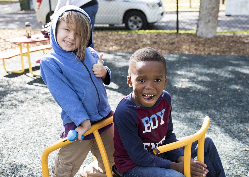 Tommy Pettiti, left, plays with a Children First preschooler.