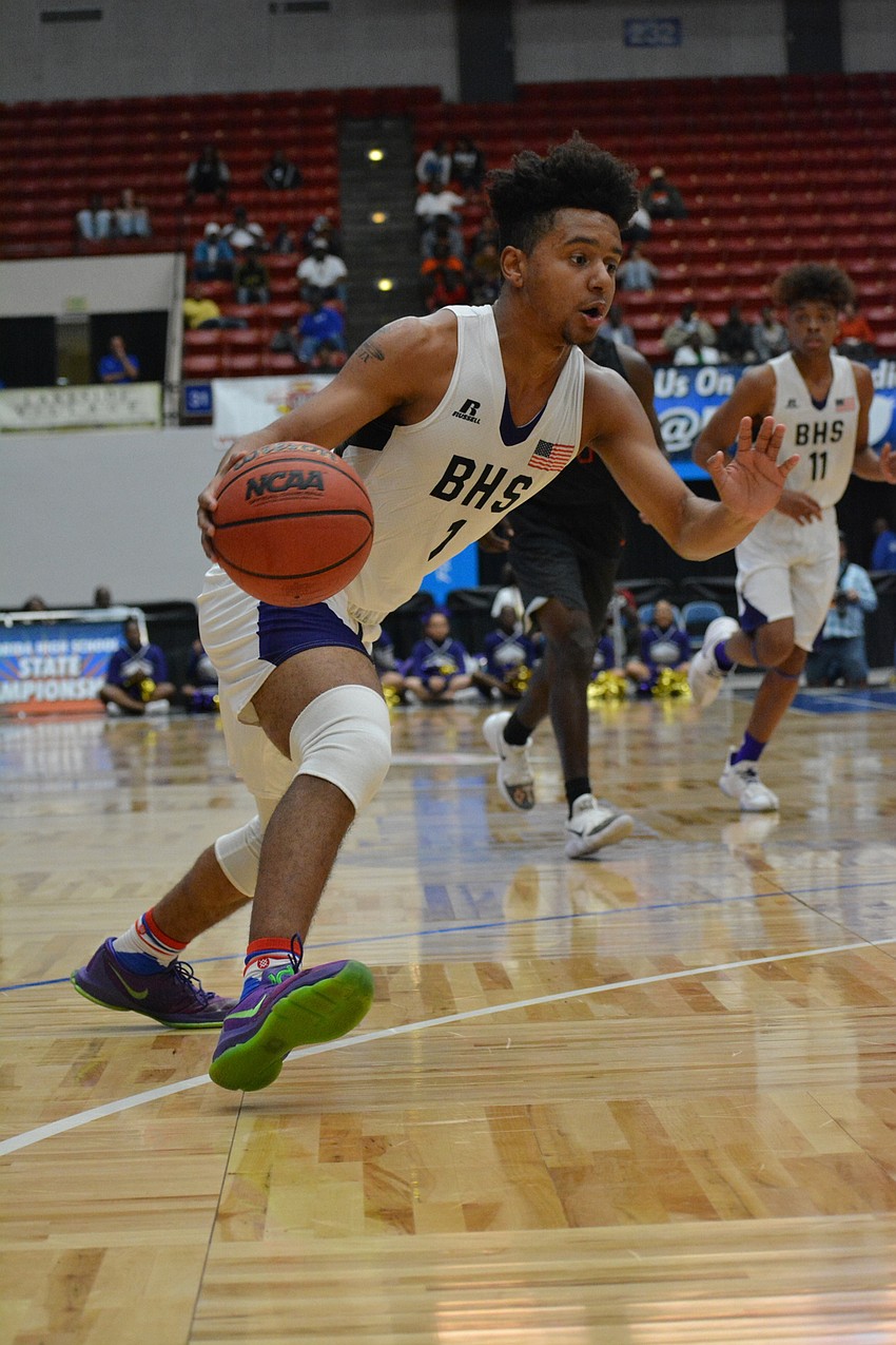 Jordan Curtis takes a drive to the basket. He finished with 12 points.