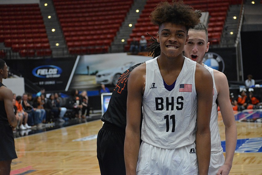 Johnnie Willaims IV stares down the camera after hitting a bucket and getting fouled.