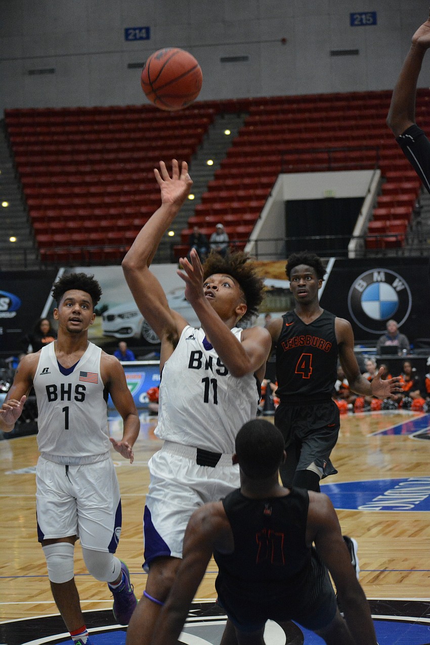 Johnnie Williams IV hits a circus shot against Leesburg. He finished with 16 points and 10 rebounds.