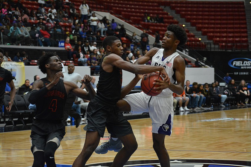 Jordan Clark gets the ball taken from him by a Leesburg defender.