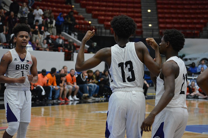 Jordan Clark (13) flexes after hitting an 
