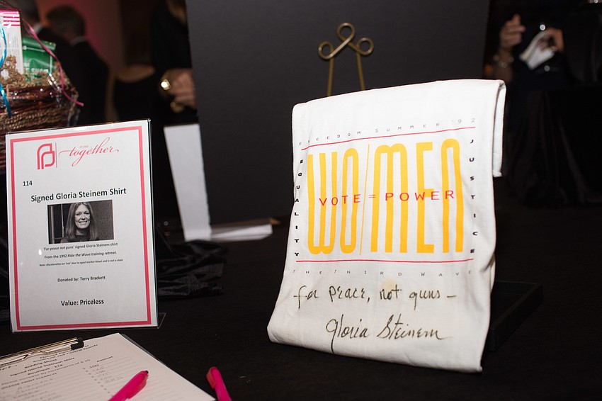 Silent auction items included this shirt signed by journalist Gloria Steinem.