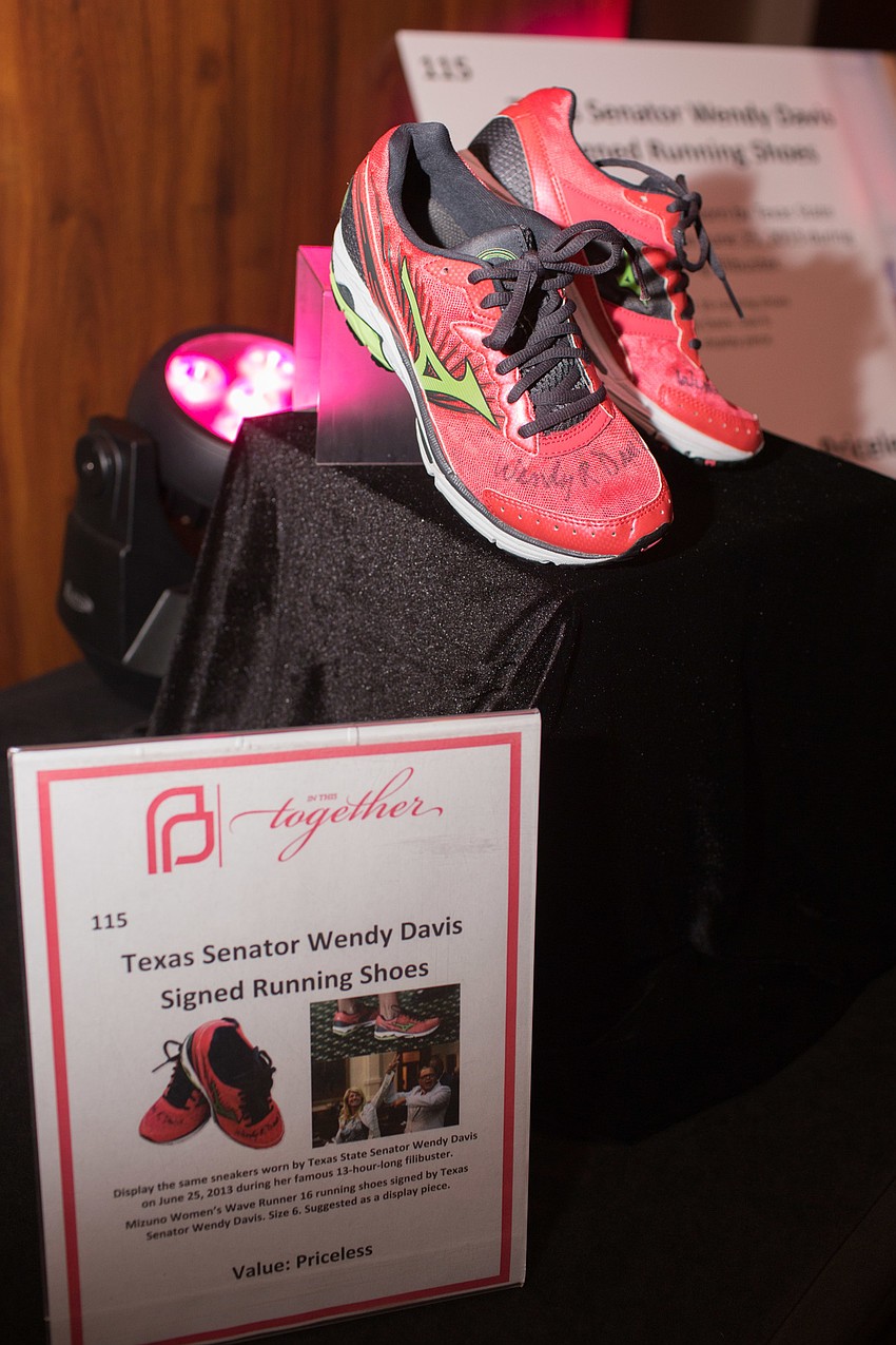 A pair of pink sneakers signed by former Texas Senator Wendy Davis were up for bids in the silent auction.